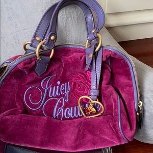 Burgundy Juicy purse with zipper closure.